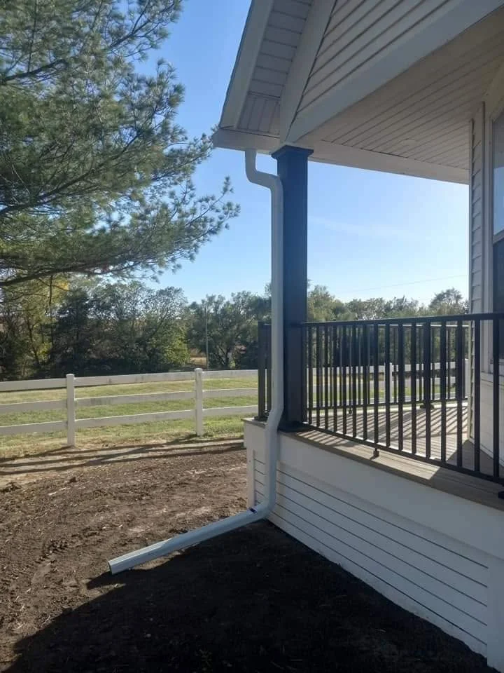 New downspout installed at a residential porch